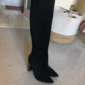 Black over the knee stretchy heeled boots